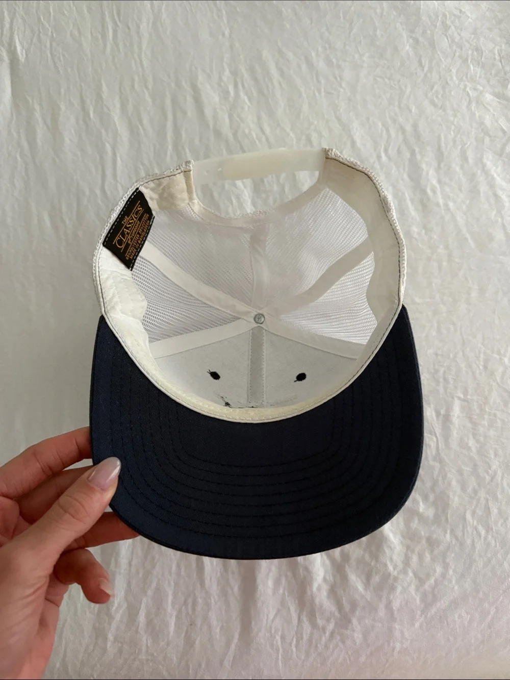 New Bedford Ship Supply Navy & White Trucker Hat with Red Boat Embroidery